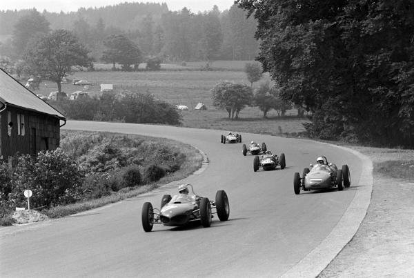 Giancarlo Baghetti (ITA) Ferrari 156, who retired early with faulty ignition wiring, leads seventh place finisher Carel Godin de Beaufort (NED) Porsche 718, ninth place finisher Lucien Bianchi (BEL) Lotus 18/21, eighth placed Maurice Trintignant Rob Walker Lotus 24 and Jo Siffert (SUI) Lotus 21 who finished tenth on his Grand Prix race.
Belgian Grand Prix, Spa-Francorchamps, 17 June 1962.
Giancarlo Baghetti (ITA) Ferrari 156, who retired early with faulty ignition wiring, leads seventh place finisher Carel Godin de Beaufort (NED) Porsche 718, ninth place finisher Lucien Bianchi (BEL) Lotus 18/21, eighth placed Maurice Trintignant Rob Walker Lotus 24 and Jo Siffert (SUI) Lotus 21 who finished tenth on his Grand Prix race.
Belgian Grand Prix, Spa-Francorchamps, 17 June 1962.