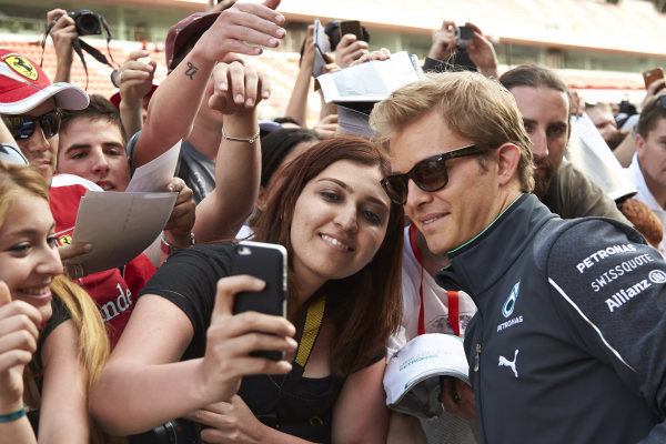 Circuit de Catalunya, Barcelona, Spain.
Thursday 8 May 2014.
Nico Rosberg, Mercedes AMG, has his picture taken with a fan.
World Copyright: Steve EtheringtonLAT Photographic.
ref: Digital Image SNE22307 copy