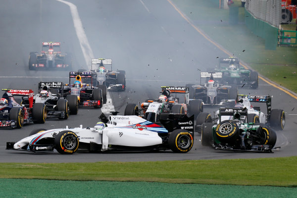 Albert Park, Melbourne, Australia.
Sunday 16 March 2014.
Kamui Kobayashi, Caterham CT05 Renault, collides with Felipe Massa, Williams FW36 Mercedes, at the start ending both their races.
World Copyright: Alastair Staley/LAT Photographic.
ref: Digital Image _79P8053