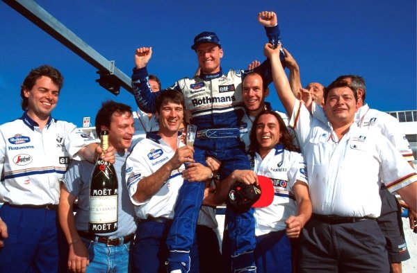 David Coulthard (GBR) Williams celebrates his first Grand Prix victory with members of the Williams team.
Portuguese Grand Prix, Estoril, 24 September 1995.
