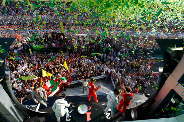 Albert Park, Melbourne, Australia.
Sunday 26 March 2017.
A burst of ticker tape covers the podium. Race winner Sebastian Vettel, Ferrari, 1st Position, celebrates with Luigi Fraboni, Head of Power Unit Race Operation, Ferrari. The pair are joined by Lewis Hamilton, Mercedes AMG, 2nd Position, and Valtteri Bottas, Mercedes AMG, 3rd Position.
World Copyright: Steven Tee/LAT Images
Ref: Digital Image _O3I3225