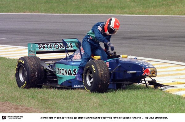 1998 Brazilian Grand Prix.
Interlagos, Sao Paulo, Brazil.
27-29 March 1998.
Johnny Herbert (Sauber C17 Petronas Ferrari) climbs from his car after crashing during qualifying.
World Copyright - Steve Etherington/LAT Photographic

