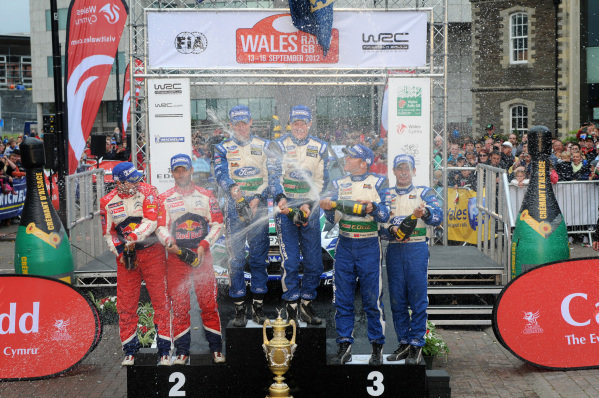 Podium (L to R): Second place finishers Sebastien Loeb (FRA) and Daniel Elena (MC), Citroen, rally winners Jari-Matti Latvala (FIN) and Miikka Anttila (FIN), Ford and third placed finishers Petter Solberg (NOR) and Chris Patterson (GBR), Ford with the champagne.
FIA World Rally Championship, Rd10, Wales Rally GB, Day Three, Cardiff, Wales, 16 September 2012. Podium (L to R): Second place finishers Sebastien Loeb (FRA) and Daniel Elena (MC), Citroen, rally winners Jari-Matti Latvala (FIN) and Miikka Anttila (FIN), Ford and third placed finishers Petter Solberg (NOR) and Chris Patterson (GBR), Ford with the champagne.
FIA World Rally Championship, Rd10, Wales Rally GB, Day Three, Cardiff, Wales, 16 September 2012.