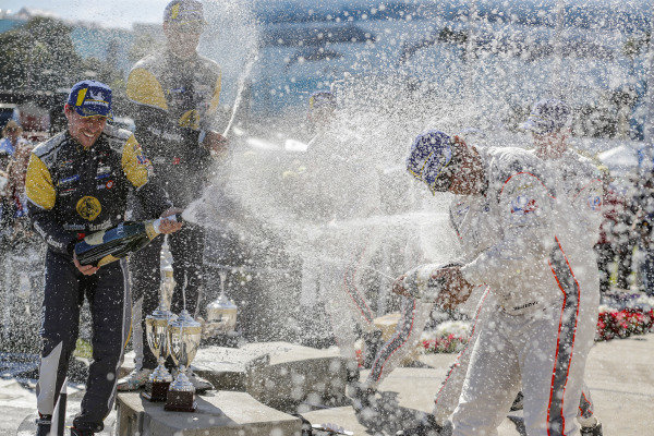 #5 Mustang Sampling Racing Cadillac DPi, DPi: Joao Barbosa, Filipe Albuquerque, #6 Acura Team Penske Acura DPi, DPi: Juan Pablo Montoya, Dane Cameron, #7 Acura Team Penske Acura DPi, DPi: Helio Castroneves, Ricky Taylor celebrate on the podium with champagne #5 Mustang Sampling Racing Cadillac DPi, DPi: Joao Barbosa, Filipe Albuquerque, #6 Acura Team Penske Acura DPi, DPi: Juan Pablo Montoya, Dane Cameron, #7 Acura Team Penske Acura DPi, DPi: Helio Castroneves, Ricky Taylor celebrate on the podium with champagne