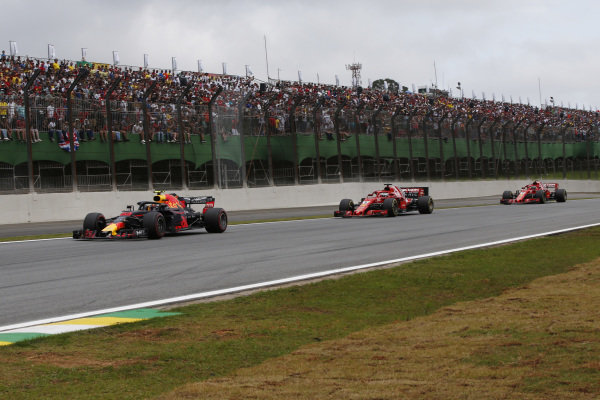 Max Verstappen, Red Bull Racing RB14 leads Kimi Raikkonen, Ferrari SF71H and Sebastian Vettel, Ferrari SF71H