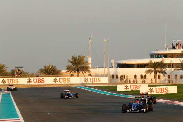 Yas Marina Circuit, Abu Dhabi, United Arab Emirates.
Sunday 29 November 2015.
Felipe Nasr, Sauber C34 Ferrari, leads Romain Grosjean, Lotus E23 Mercedes, and Marcus Ericsson, Sauber C34 Ferrari.
World Copyright: Charles Coates/LAT Photographic
ref: Digital Image _99O1903