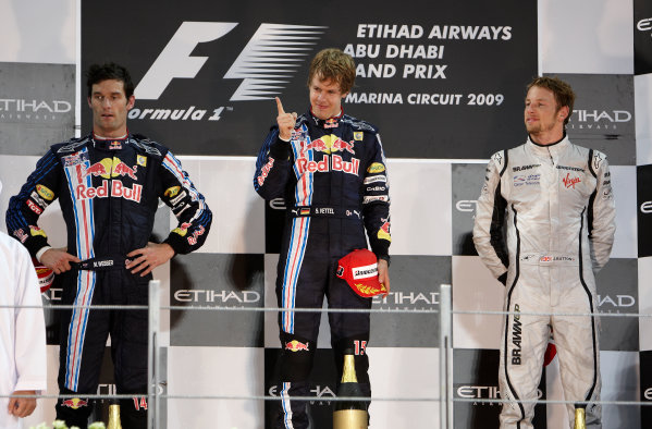 Yas Marina Circuit, Abu Dhabi, United Arab Emirates
1st November 2009.
Mark Webber, Red Bull Racing RB5 Renault, 2nd position, Sebastian Vettel, Red Bull Racing RB5 Renault, 1st position, and Jenson Button, Brawn GP BGP001 Mercedes, 3rd position, celebrate on the podium. Portrait. Podium. 
World Copyright: Steve Etherington/LAT Photographic
ref: Digital Image SNE17942