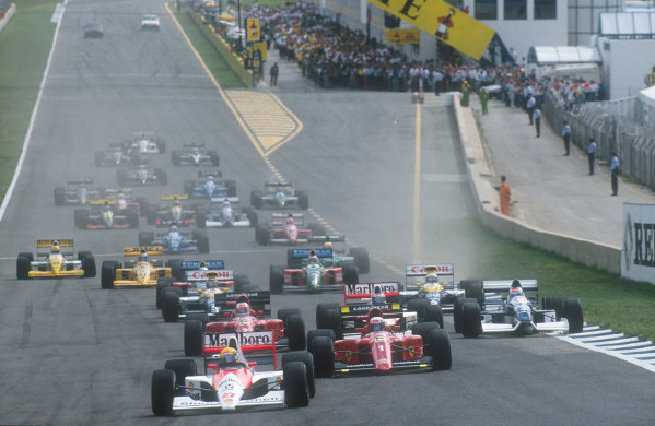 1990 Spanish Grand Prix.
Jerez, Spain.
28-30 September 1990.
Ayrton Senna (McLaren MP4/5B Honda) leads Alain Prost, Nigel Mansell (both Ferrari 641's), Gerhard Berger (McLaren MP4/5B Honda), Jean Alesi (Tyrrell 019 Ford)(note punctured tyre, his left rear), Riccardo Patrese, Thierry Boutsen (both Williams FW13B Renault's), Alessandro Nannini and Nelson Piquet (both Benetton B190 Ford's) at the start.
Ref-90 ESP 15.
World Copyright - LAT Photographic
1990 Spanish Grand Prix.
Jerez, Spain.
28-30 September 1990.
Ayrton Senna (McLaren MP4/5B Honda) leads Alain Prost, Nigel Mansell (both Ferrari 641's), Gerhard Berger (McLaren MP4/5B Honda), Jean Alesi (Tyrrell 019 Ford)(note punctured tyre, his left rear), Riccardo Patrese, Thierry Boutsen (both Williams FW13B Renault's), Alessandro Nannini and Nelson Piquet (both Benetton B190 Ford's) at the start.
Ref-90 ESP 15.
World Copyright - LAT Photographic