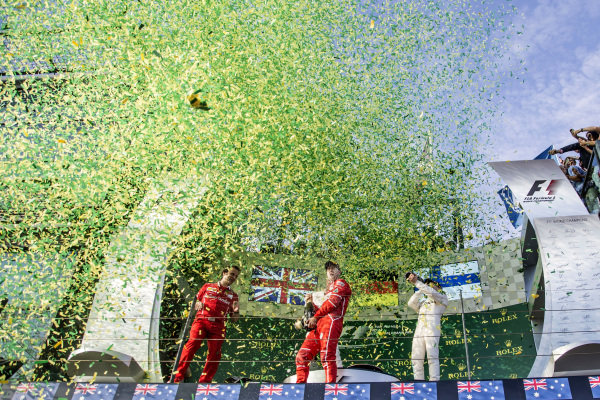Lewis Hamilton (GBR) Mercedes AMG F1, Luigi Fraboni (ITA) Ferrari Head of Engine Trackside Operations, race winner Sebastian Vettel (GER) Ferrari and Valtteri Bottas (FIN) Mercedes AMG F1 celebrate on the podium with the champagne at Formula One World Championship, Rd1, Australian Grand Prix, Race, Albert Park, Melbourne, Australia, Sunday 26 March 2017. Lewis Hamilton (GBR) Mercedes AMG F1, Luigi Fraboni (ITA) Ferrari Head of Engine Trackside Operations, race winner Sebastian Vettel (GER) Ferrari and Valtteri Bottas (FIN) Mercedes AMG F1 celebrate on the podium with the champagne at Formula One World Championship, Rd1, Australian Grand Prix, Race, Albert Park, Melbourne, Australia, Sunday 26 March 2017.