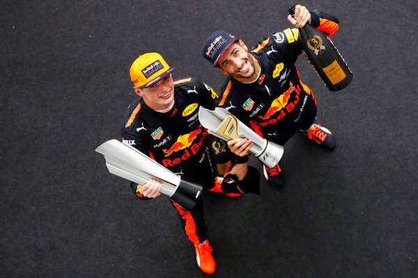 Sepang International Circuit, Sepang, Malaysia.
Sunday 1 October 2017.
Winner Max Verstappen, Red Bull Racing, and Daniel Ricciardo, Red Bull Racing, celebrate on the podium.
World Copyright: Steven Tee/LAT Images 
ref: Digital Image _R3I5793