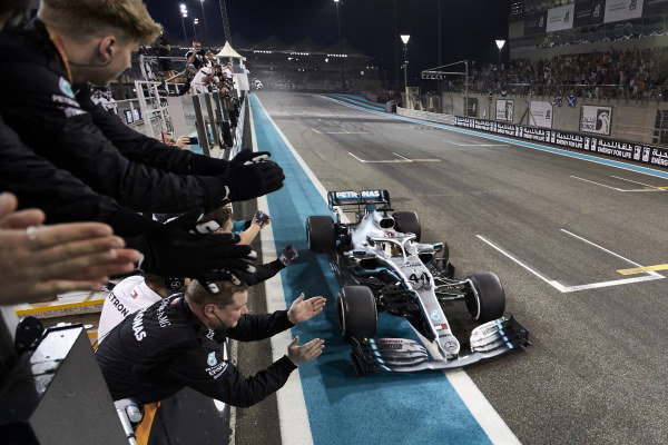 Lewis Hamilton, Mercedes AMG F1 W10, 1st position, passes his team on the pit wall as they celebrate Lewis Hamilton, Mercedes AMG F1 W10, 1st position, passes his team on the pit wall as they celebrate