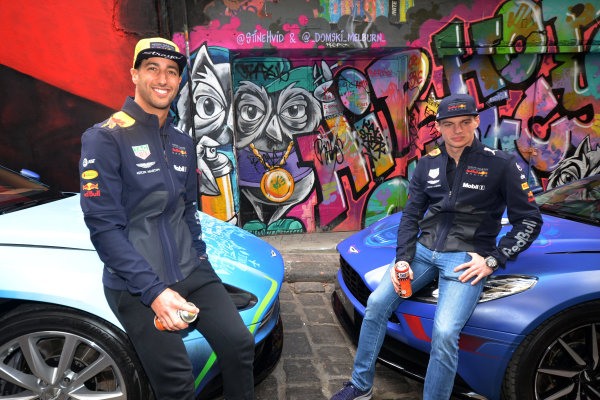 Daniel Ricciardo (AUS) Red Bull Racing and Max Verstappen (NED) Red Bull Racing with the street art styled Aston Martin DB11 in Hosier Lane.