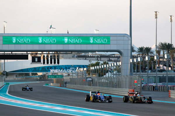 Yas Marina Circuit, Abu Dhabi, United Arab Emirates.
Sunday 29 November 2015.
Romain Grosjean, Lotus E23 Mercedes, leads Felipe Nasr, Sauber C34 Ferrari, and Marcus Ericsson, Sauber C34 Ferrari.
World Copyright: Sam Bloxham/LAT Photographic
ref: Digital Image _SBL8595