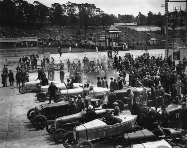1925 BARC Whitsun Bank Holiday Meeting.
Brooklands, England. June 1925.
Top to bottom: #4 Kidston's Bugatti, #5 Coe's 30-98 Vauxhall 'Vixen' (which was to be seriously damaged in an accident during the 100mph Short Handicap), Barnato's 3-litre Bentley, #7 is Scriven's Austin 20, #8 Lanfranchi's Alfa-Romeo, #9 is J C Douglas with 'Razor-Blade', #10 is H L Aldridge's Alvis, #11 is Benjafield's Salmson, the Austin is Francis Samuelson's, and there is a second #14 A Y Jackson12-50 Alvis, just creeping into the bottom of the photo.
World Copyright: LAT Photographic.
Ref: Autocar Glass Plate A4777. 1925 BARC Whitsun Bank Holiday Meeting.
Brooklands, England. June 1925.
Top to bottom: #4 Kidston's Bugatti, #5 Coe's 30-98 Vauxhall 'Vixen' (which was to be seriously damaged in an accident during the 100mph Short Handicap), Barnato's 3-litre Bentley, #7 is Scriven's Austin 20, #8 Lanfranchi's Alfa-Romeo, #9 is J C Douglas with 'Razor-Blade', #10 is H L Aldridge's Alvis, #11 is Benjafield's Salmson, the Austin is Francis Samuelson's, and there is a second #14 A Y Jackson12-50 Alvis, just creeping into the bottom of the photo.
World Copyright: LAT Photographic.
Ref: Autocar Glass Plate A4777.