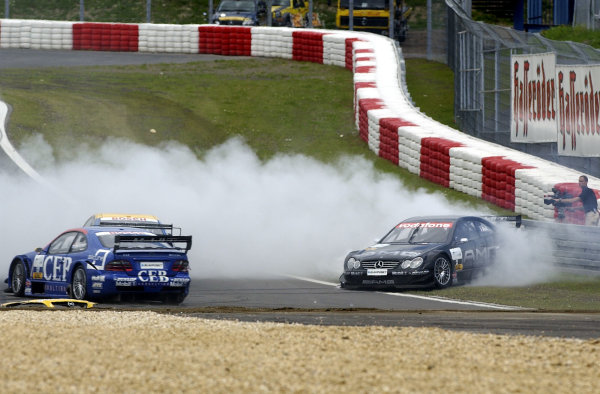 2002 DTM Championship 
Nurburgring, Germany. 2th - 4th August 2002. 
Jean Alesi (Mercedes CLK-DTM) spins into the tyre wall after colliding with Alain Menu (Opel Astra V8 Coupe), action.
World Copyright: Andre Irlmeier/LAT Photographic

