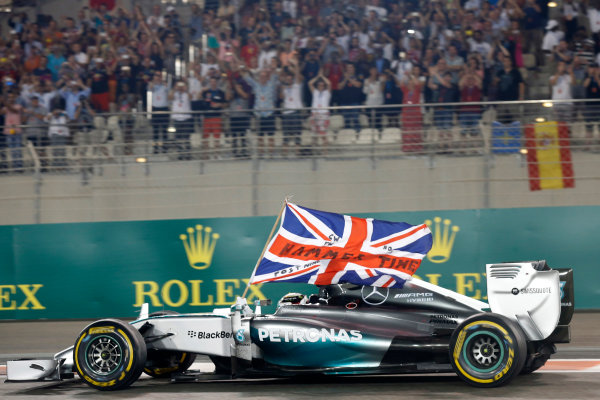 Yas Marina Circuit, Abu Dhabi, United Arab Emirates.
Sunday 23 November 2014.
Lewis Hamilton, Mercedes F1 W05 Hybrid, celebrates after winning the race and the 2014 Drivers Championship.
World Copyright: Alastair Staley/LAT Photographic.
ref: Digital Image _79P0850