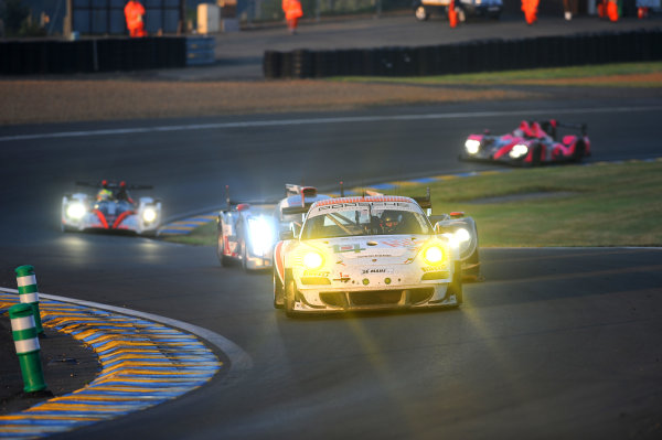 Circuit de La Sarthe, Le Mans, France. 13th - 17th June 2012. 
Race
Paul Daniels/Markus Palttala/Joel Camathias, JWA-AVILA, No
55 Porsche 911 RSR (997), leads Andrea Belicchi/Harold Primat/Jeroen Bleekemolen, Rebellion Racing, No
13 Lola B12/60 Coupe - Toyota, and Andre Lotterer/Marcel Fassler/Benoit Treluyer, Audi Sport Team Joest, No
1 Audi R18 E-Tron Quattro Hybrid. 
Photo: Jeff Bloxham/LAT Photographic. 
ref: Digital Image DSC_4676