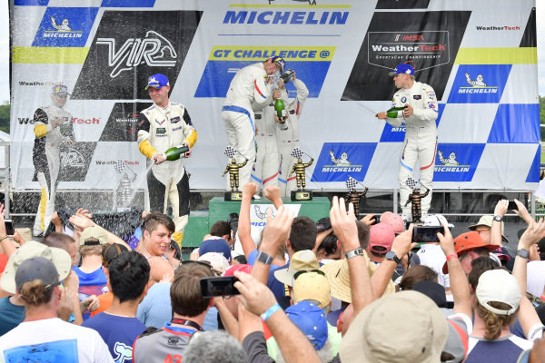 #25 BMW Team RLL BMW M8, GTLM: Alexander Sims, Connor de Phillippi, #3 Corvette Racing Chevrolet Corvette C7.R, GTLM: Antonio Garcia, Jan Magnussen, #24 BMW Team RLL BMW M8 GTLM: John Edwards, Jesse Krohn celebrate the win on the podium