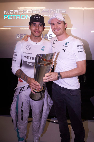 Yas Marina Circuit, Abu Dhabi, United Arab Emirates.
Sunday 23 November 2014. 
Nico Rosberg, Mercedes AMG, congratulates teammate Lewis Hamilton on his championship victory. 
World Copyright: Steve Etherington/LAT Photographic.
ref: Digital Image SNE13518