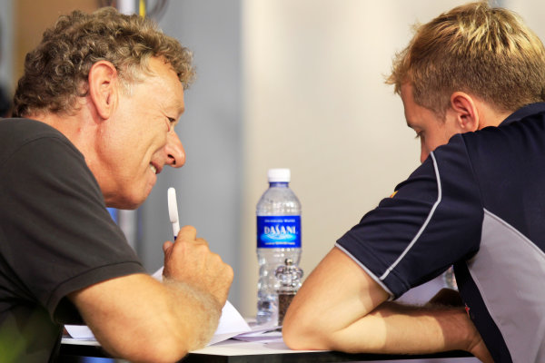 Marina Bay Circuit, Singapore.
Saturday 21st September 2013.
Sebastian Vettel, Red Bull Racing talks with F1 circuit designer Hermann Tilke.
World Copyright: Charles Coates/LAT Photographic.
ref: Digital Image _X5J9733