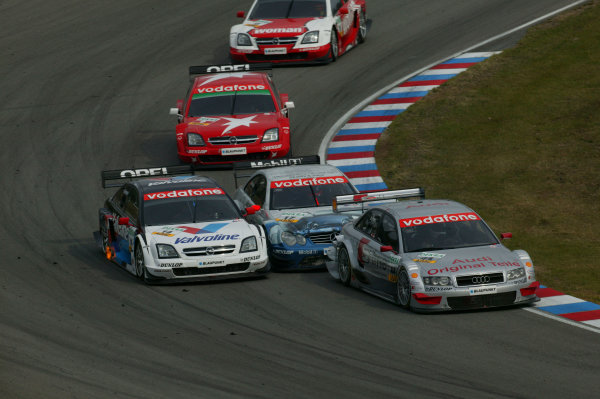 2004 DTM Championship.
Brno, Czech Repulic. 18th - 19th September
Emanuelle Pirro (Joest Audi A4) leads Markus Winkelhock (Persson Motorsport Mercedes CLK) , Peter Dumbreck (OPC Phoenix Opel Vectra GTS) , Heinz Harald Frentzen (OPC Holzer Opel Vectra GTS) and Timo Scheider (OPC Holzer Opel Vectra GTS). Action. 
World Copyright: Andre Irlmeier/LAT Photographic
Ref:Digital image only