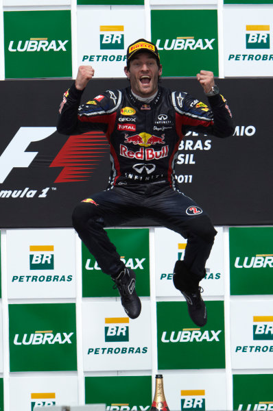 Interlagos, Sao Paulo, Brazil.
27th November 2011.
Mark Webber, Red Bull Racing RB7 Renault, 1st position, celebrates victory. Portrait. Podium. 
World Copyright: Steve Etherington/LAT Photographic
ref: Digital Image SNE28293